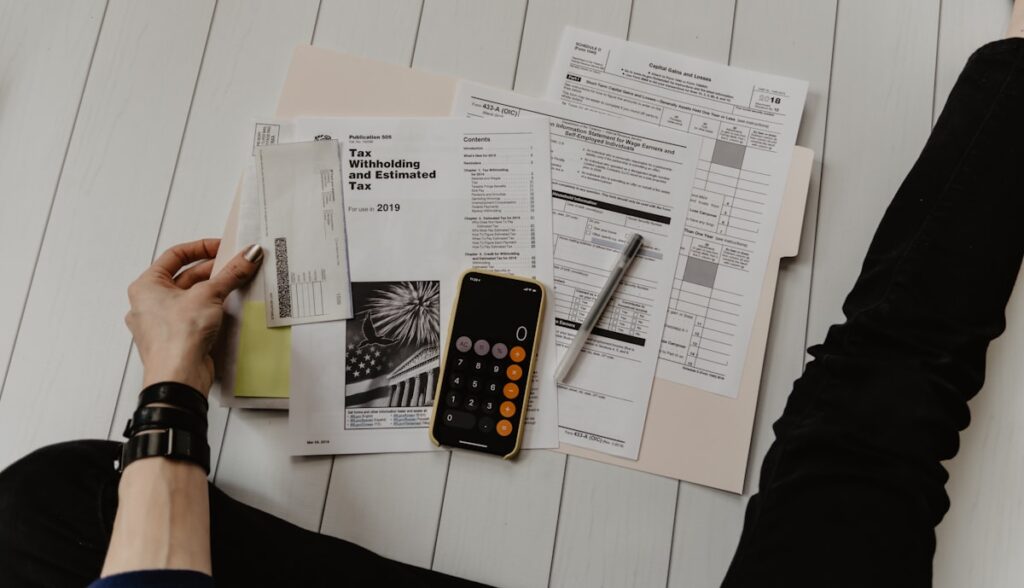 Reviewing financial documents with a calculator