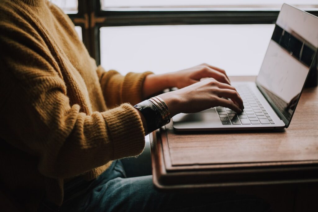 Student working on a statement of purpose on a laptop